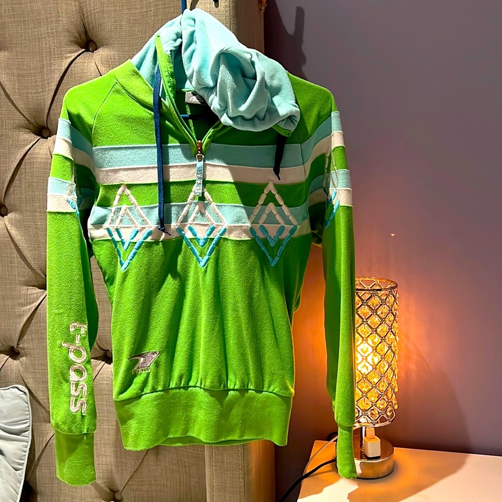 Green and blue hoodie.